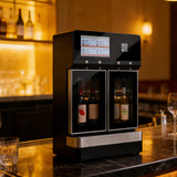 Black 4-tap wine dispenser with glass display doors on a bar counter, bottles of wine visible inside