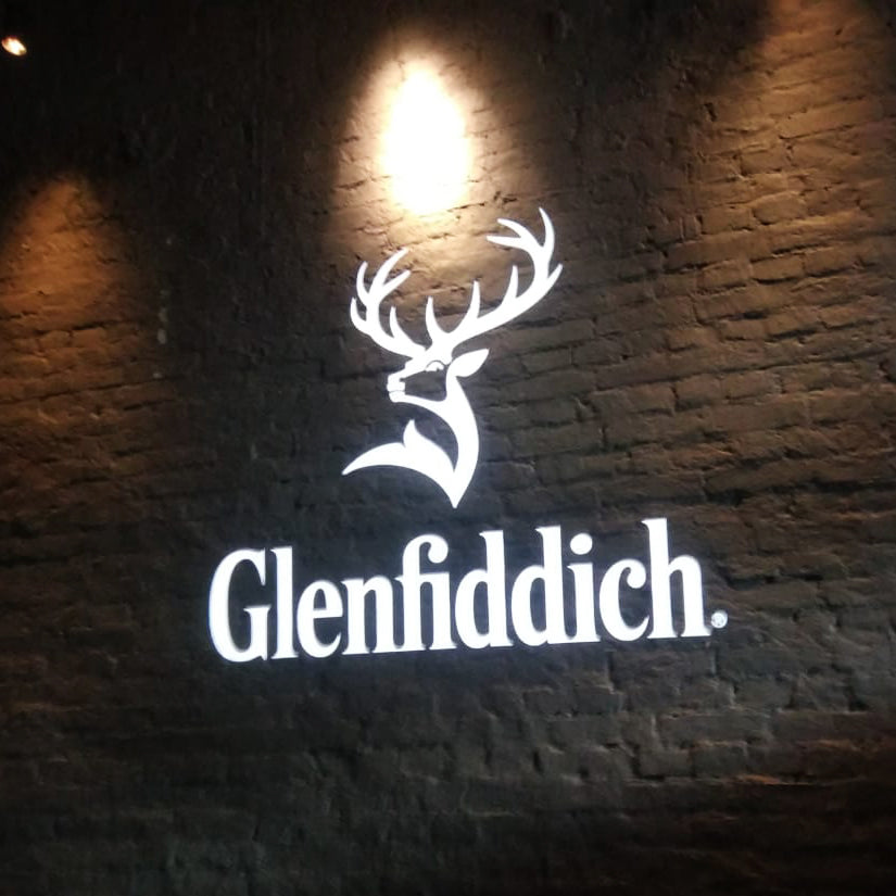 Brand logo projected onto a surface by a gobo projector