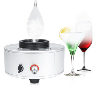 Glass chiller frosting a martini glass rim with dense CO2 smoke beside green and red cocktails