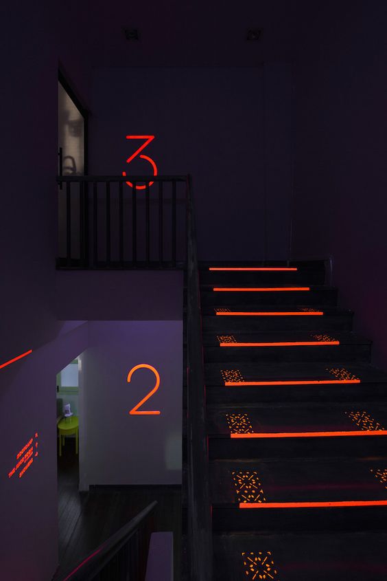 Directional sign projected onto the floor as wayfinding