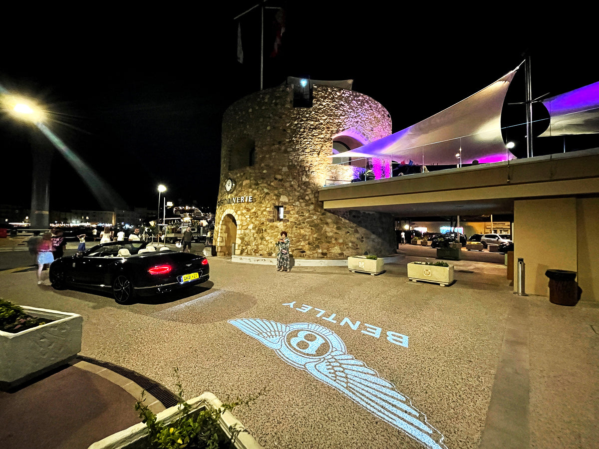 Brand logo projected onto a surface by a gobo projector