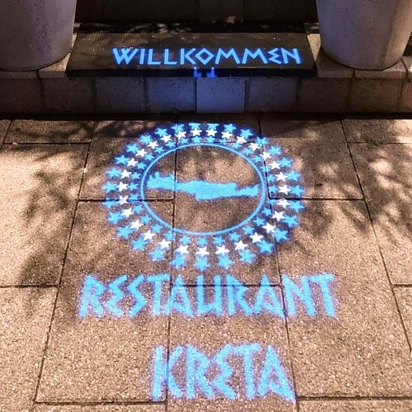 Brand logo projected onto a surface by a gobo projector