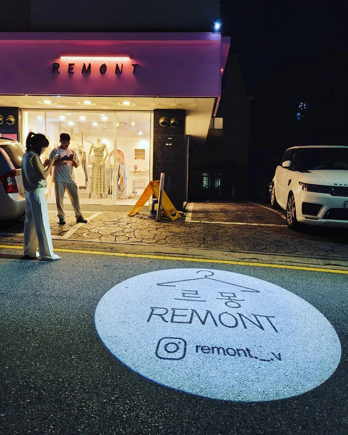Brand logo projected onto a surface by a gobo projector