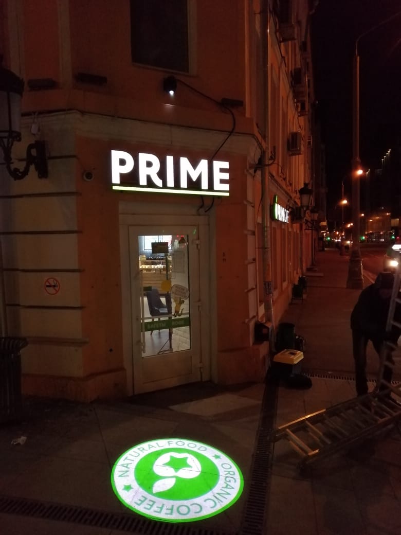 Brand logo projected onto a surface by a gobo projector