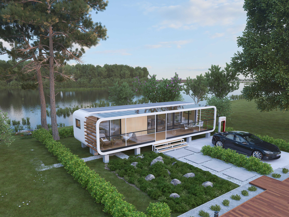Modular glass cabin on stilts beside a lake, with a dark sedan parked at a charging station and entry stairs leading up