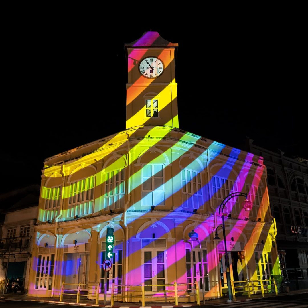 Logo projected across the facade of a building at night