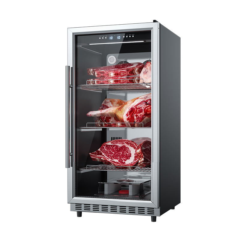 Angled view of a stainless steel dry aging cabinet on a white background with glass door open, showing three shelves of raw m