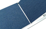 Close-up of blue fabric seam where the backrest section joins the seat, showing woven mesh texture and white frame edge