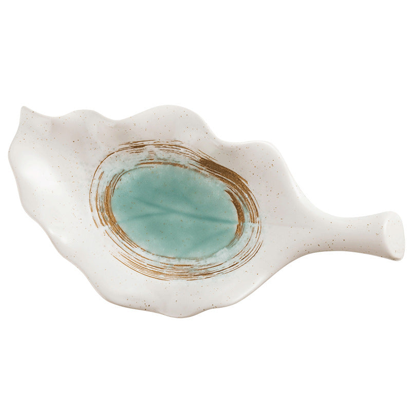 Single white ceramic leaf-shaped plate with teal oval center and gold brushstroke design
