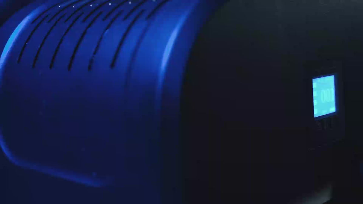 Gobo projector casting a sharp logo in light onto a surface after dark